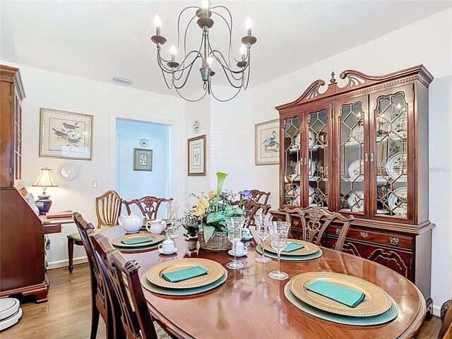 4806 SW County Road 769, Arcadia, FL 34269 - dining room with an inviting chandelier, light wood finished floors, baseboards, and visible vents