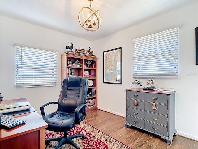 4806 SW County Road 769, Arcadia, FL 34269 - office featuring baseboards, light wood-style flooring, and a chandelier