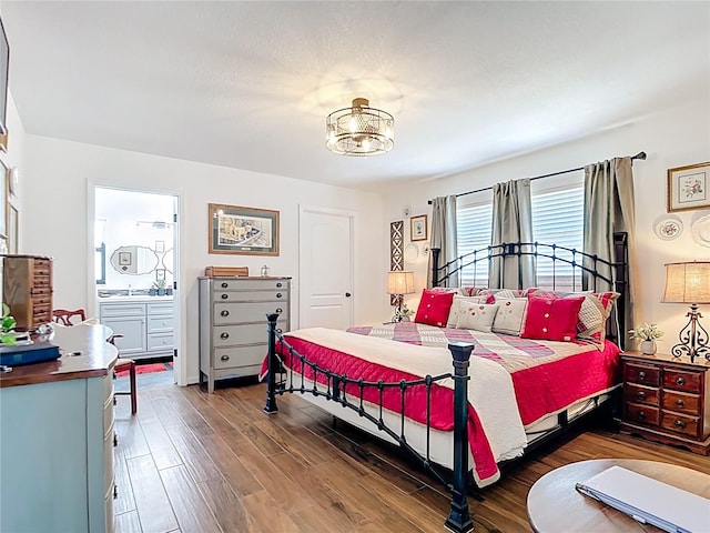 4806 SW County Road 769, Arcadia, FL 34269 - bedroom featuring wood finished floors and a notable chandelier