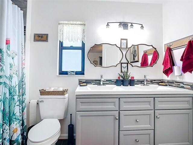 4806 SW County Road 769, Arcadia, FL 34269 - bathroom with a sink, a shower with curtain, toilet, and double vanity