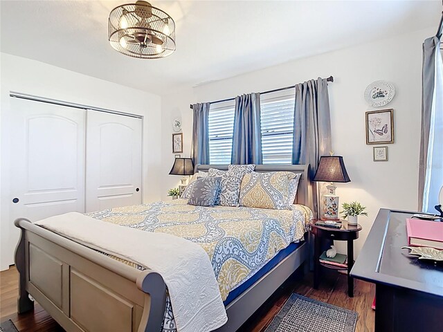 4806 SW County Road 769, Arcadia, FL 34269 - bedroom featuring a closet, wood finished floors, and a notable chandelier