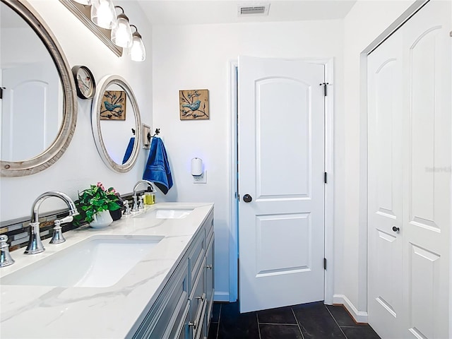 4806 SW County Road 769, Arcadia, FL 34269 - full bathroom featuring a sink, tile patterned flooring, double vanity, and visible vents