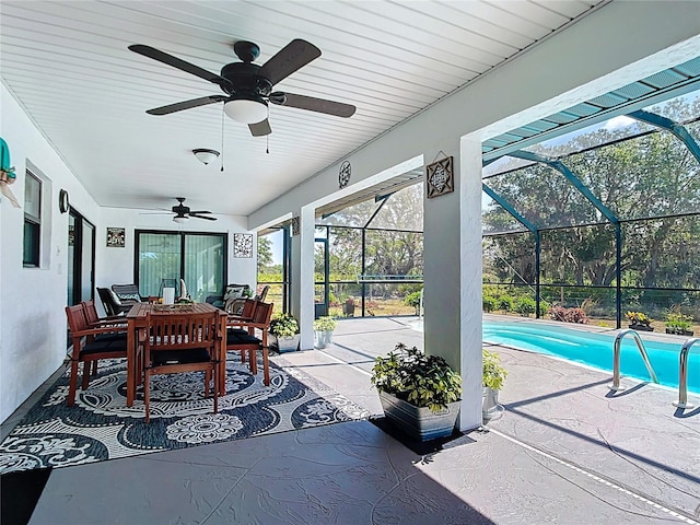 4806 SW County Road 769, Arcadia, FL 34269 - view of patio / terrace with a lanai, a ceiling fan, outdoor dining space, and an outdoor pool