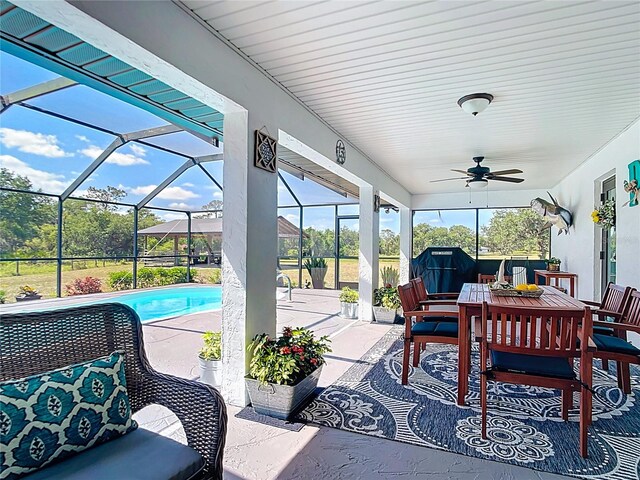 4806 SW County Road 769, Arcadia, FL 34269 - view of patio with a lanai, a ceiling fan, outdoor dining area, and an outdoor pool