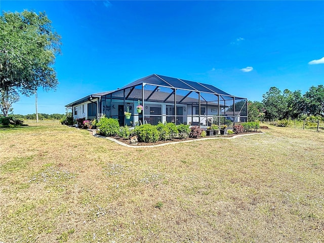 4806 SW County Road 769, Arcadia, FL 34269 - rear view of property featuring a lanai and a yard