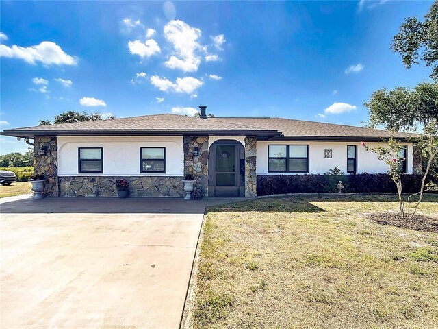 4806 SW County Road 769, Arcadia, FL 34269 - ranch-style house with concrete driveway, a front lawn, stone siding, and stucco siding