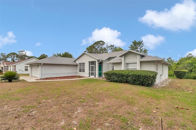 single story home with stucco siding and a front yard