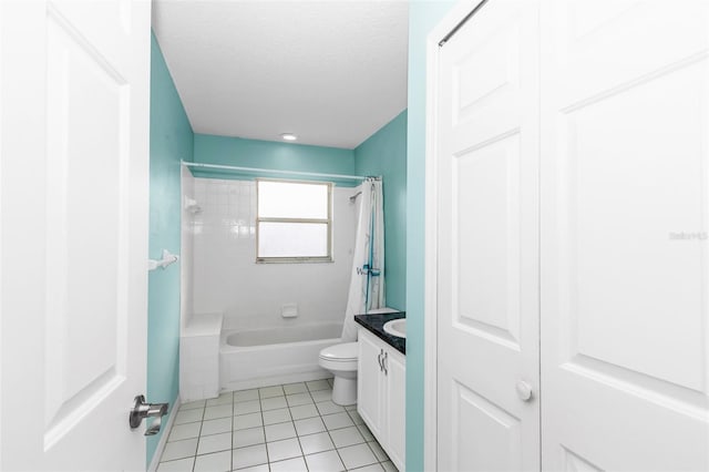 bathroom with tile patterned floors, shower / bath combo, vanity, toilet, and a textured ceiling
