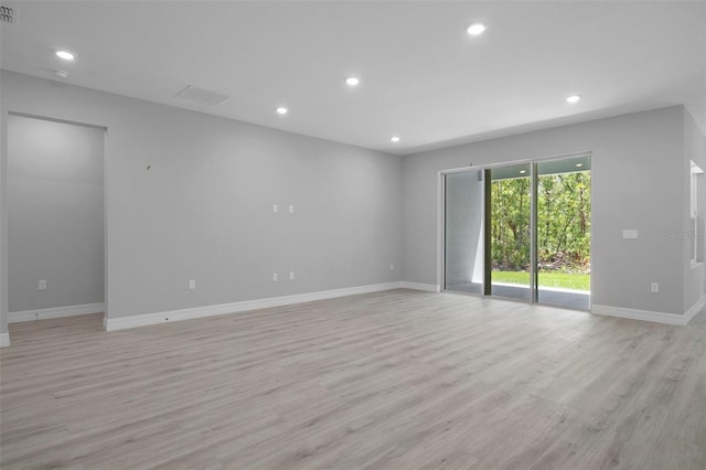 spare room featuring recessed lighting, baseboards, visible vents, and light wood finished floors