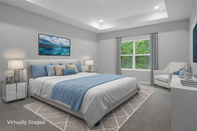 bedroom with recessed lighting, carpet flooring, baseboards, and a raised ceiling