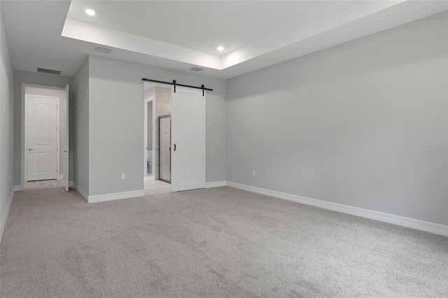 unfurnished bedroom with light colored carpet, recessed lighting, baseboards, and visible vents