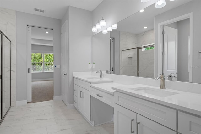 bathroom with a sink, a stall shower, and marble finish floor