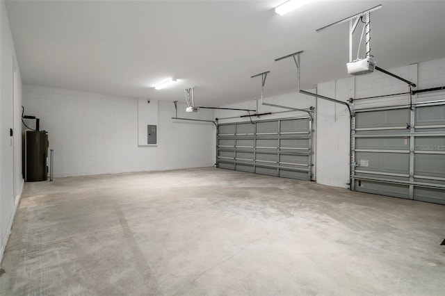 garage with a garage door opener and electric panel