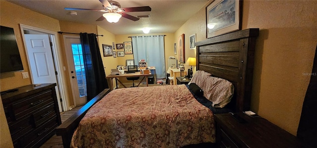 bedroom with dark wood-type flooring, visible vents, and access to outside