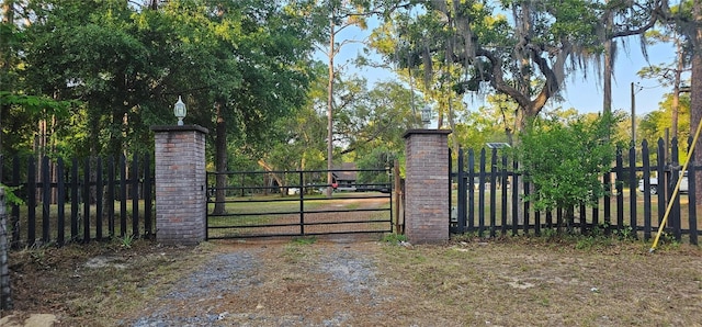 view of gate with fence