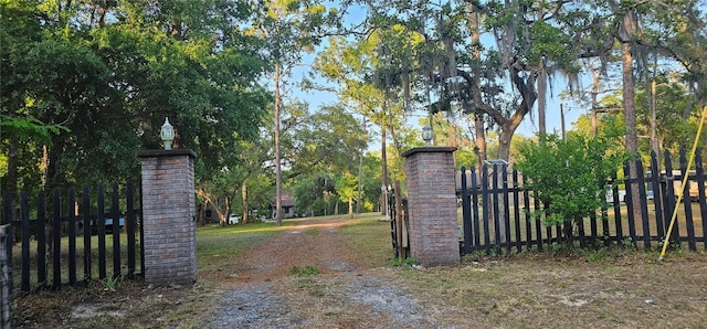 view of gate with fence