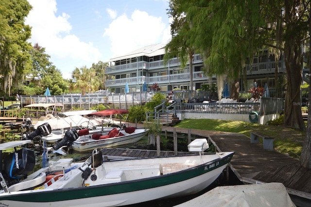 view of community with a boat dock