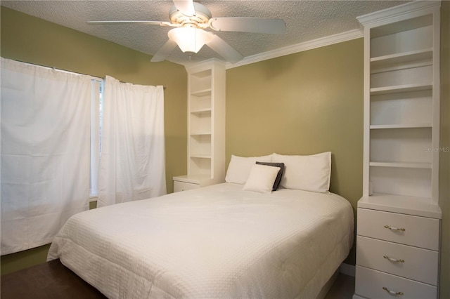 bedroom featuring ceiling fan, a textured ceiling, and crown molding
