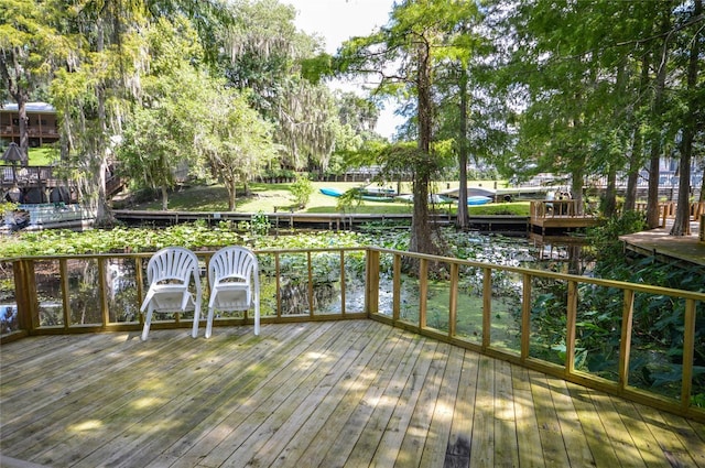 wooden terrace with a water view
