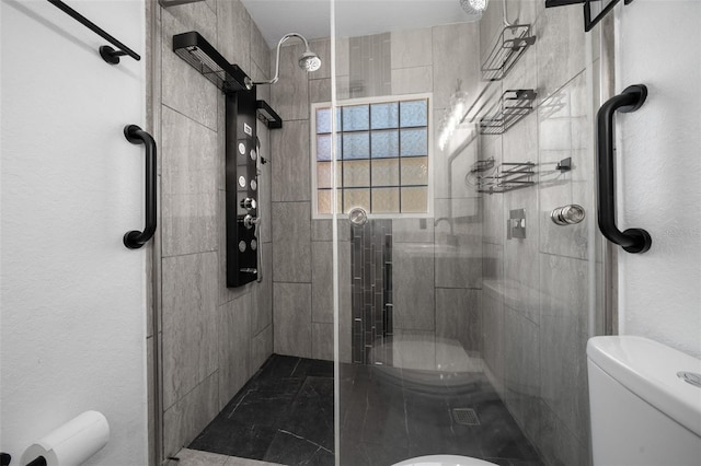 full bathroom featuring a shower stall and toilet