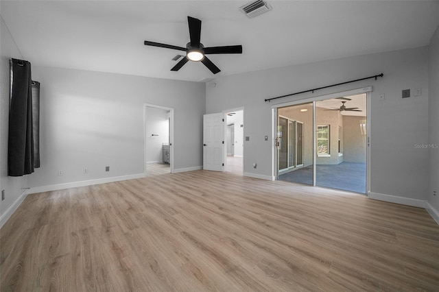 interior space featuring light wood-style flooring, visible vents, baseboards, and access to outside