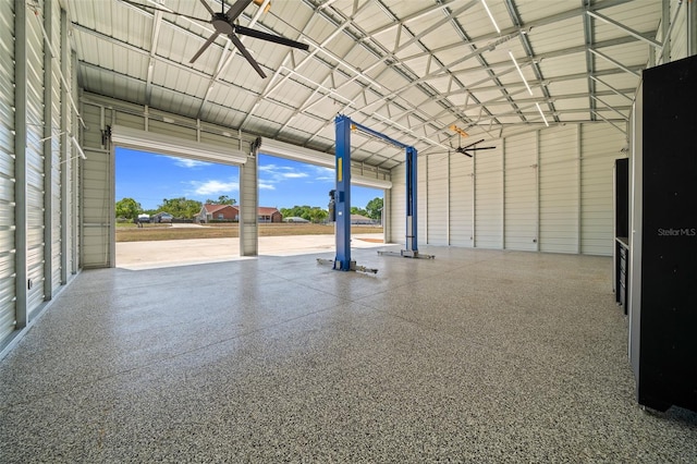 garage featuring ceiling fan and metal wall