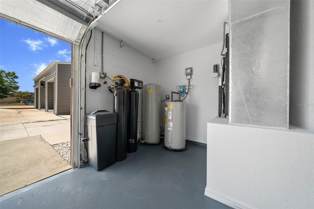 interior space with baseboards and water heater