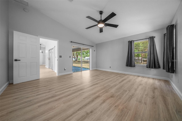 unfurnished room featuring baseboards, a wealth of natural light, a ceiling fan, and light wood-type flooring