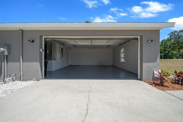 garage featuring driveway