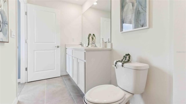 6591 SW 81st Loop, Ocala, FL 34476 - bathroom with toilet, vanity, and tile patterned floors