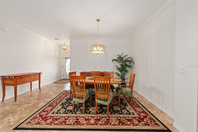 dining room featuring an inviting chandelier, ornamental molding, and baseboards