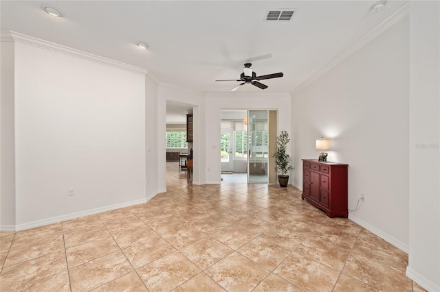 unfurnished room with baseboards, visible vents, ceiling fan, and crown molding