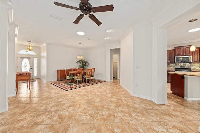 dining space featuring visible vents, ornamental molding, baseboards, and ceiling fan