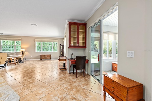 interior space featuring baseboards, ornamental molding, visible vents, and light tile patterned floors