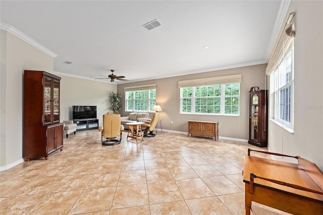living area featuring visible vents, a ceiling fan, ornamental molding, light tile patterned flooring, and baseboards