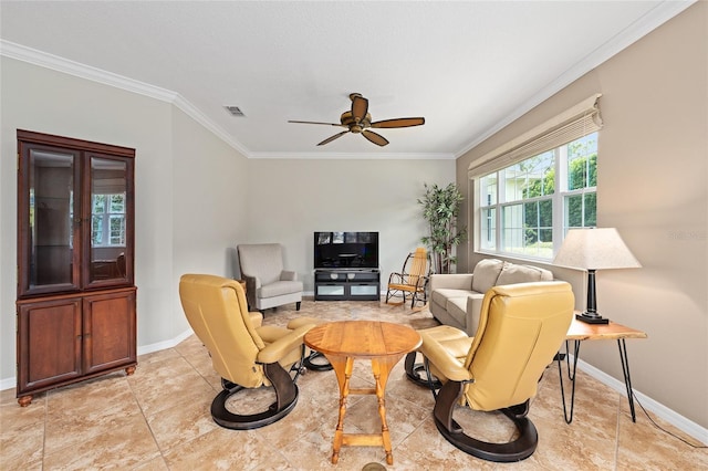 living room with visible vents, a ceiling fan, baseboards, and crown molding