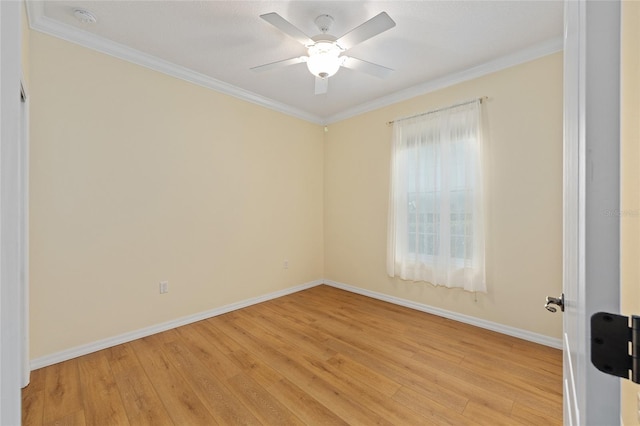 unfurnished room featuring baseboards, crown molding, and light wood-type flooring