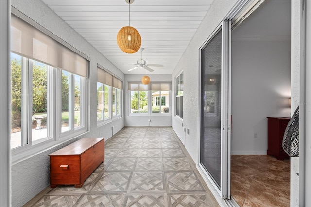 unfurnished sunroom with baseboards
