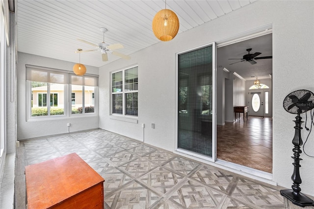 unfurnished sunroom featuring a wealth of natural light