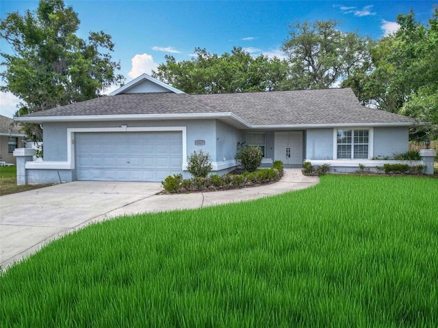 5327 SW 89th St, Ocala, FL 34476 - ranch-style house with a garage, stucco siding, concrete driveway, and a front yard