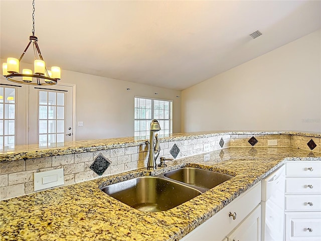 5327 SW 89th St, Ocala, FL 34476 - kitchen with visible vents, light stone countertops, dishwasher, a sink, and a chandelier