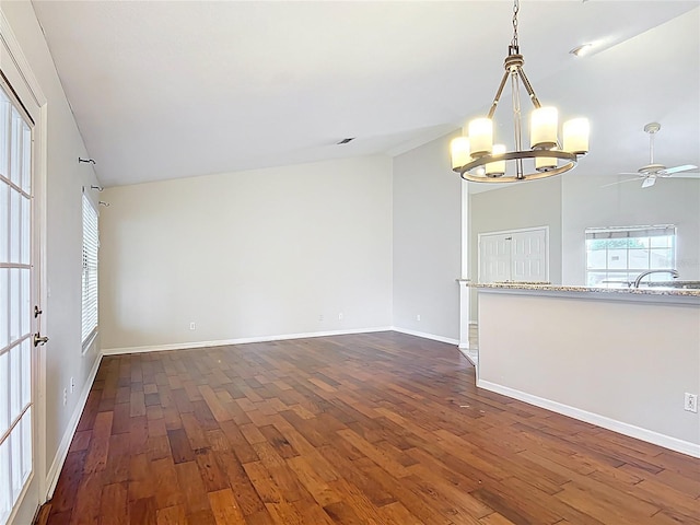 5327 SW 89th St, Ocala, FL 34476 - empty room featuring a sink, baseboards, ceiling fan with notable chandelier, and dark wood-style floors