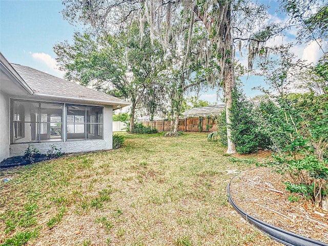 5327 SW 89th St, Ocala, FL 34476 - view of yard featuring a sunroom and a fenced backyard