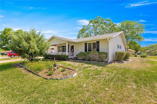 10989 SW 86th Ave, Ocala, FL 34481 - ranch-style home featuring covered porch and a front lawn