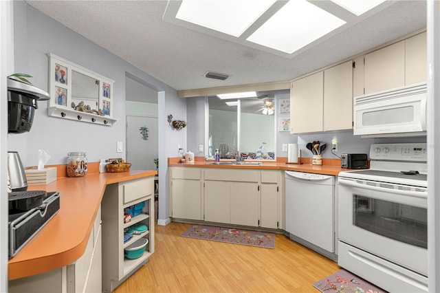 10989 SW 86th Ave, Ocala, FL 34481 - kitchen featuring white appliances, open shelves, light wood finished floors, a sink, and visible vents