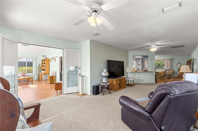 10989 SW 86th Ave, Ocala, FL 34481 - carpeted living area featuring a ceiling fan, visible vents, and a textured ceiling