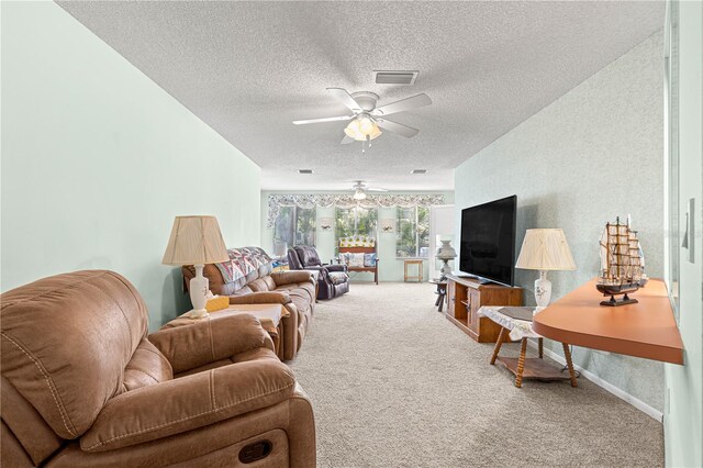 10989 SW 86th Ave, Ocala, FL 34481 - living room with a textured ceiling, visible vents, a ceiling fan, and carpet flooring