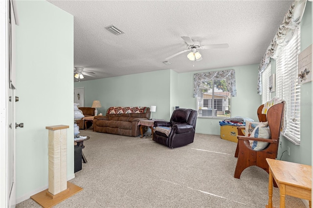 10989 SW 86th Ave, Ocala, FL 34481 - carpeted living room with visible vents, a ceiling fan, and a textured ceiling
