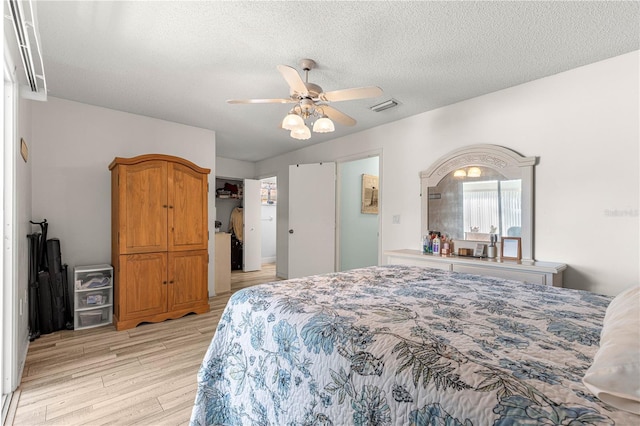 10989 SW 86th Ave, Ocala, FL 34481 - bedroom featuring visible vents, ceiling fan, a textured ceiling, and light wood finished floors