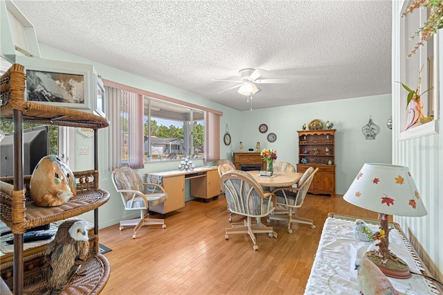 10989 SW 86th Ave, Ocala, FL 34481 - dining space with light wood finished floors, a textured ceiling, and ceiling fan